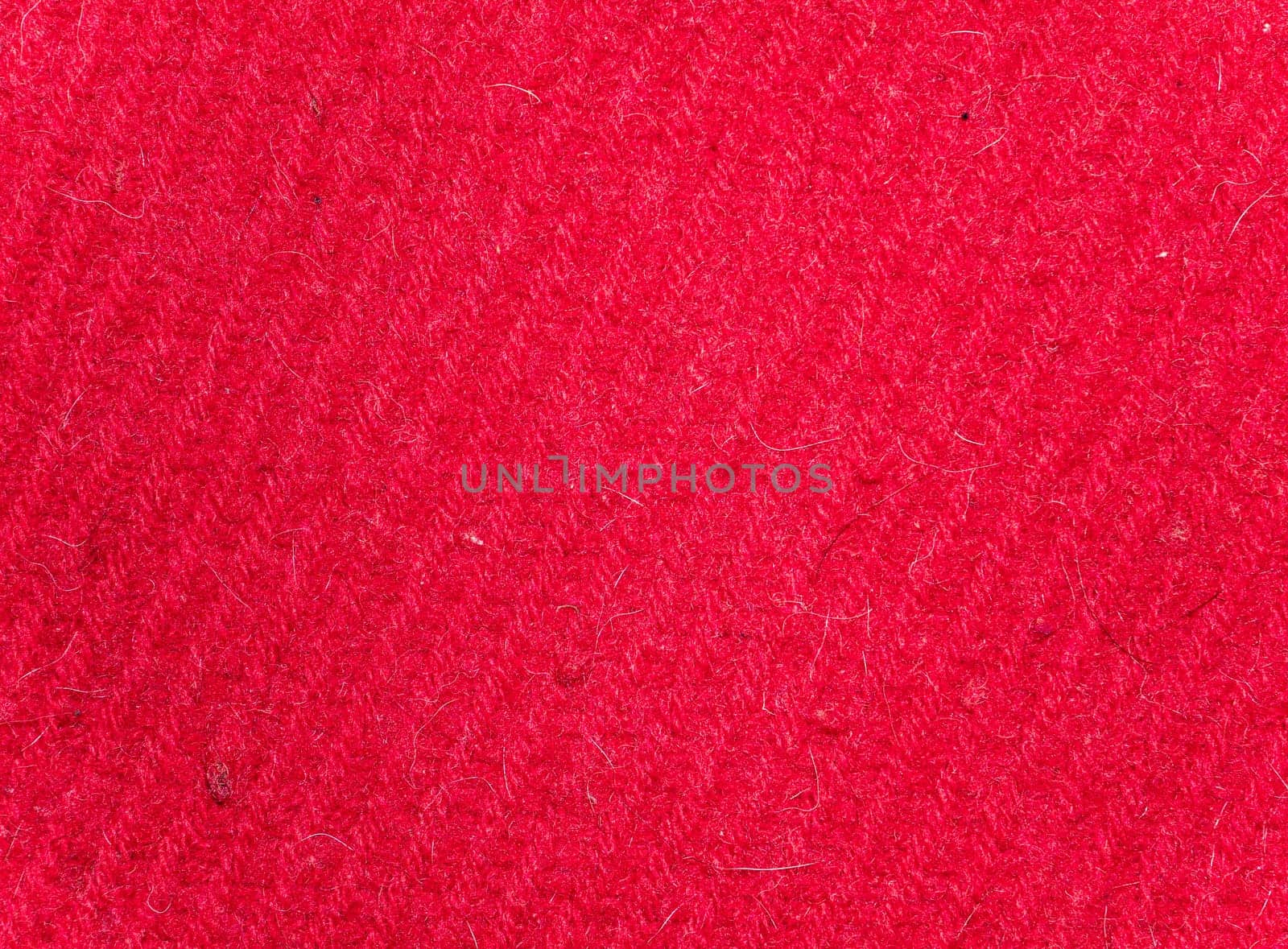Texture of red woolen knitted fabric. Background image. Place for text.