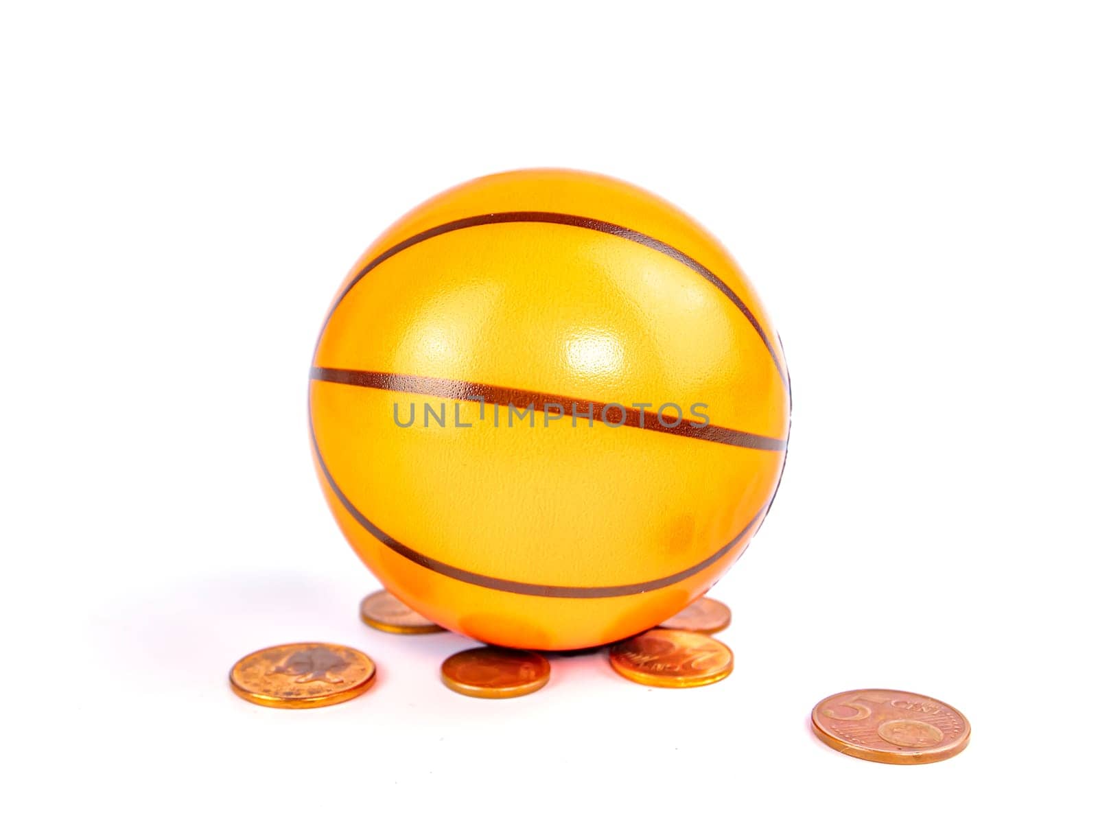 Basketball ball with coins on a white background. Sport. Tote. Background image. Place for text.
