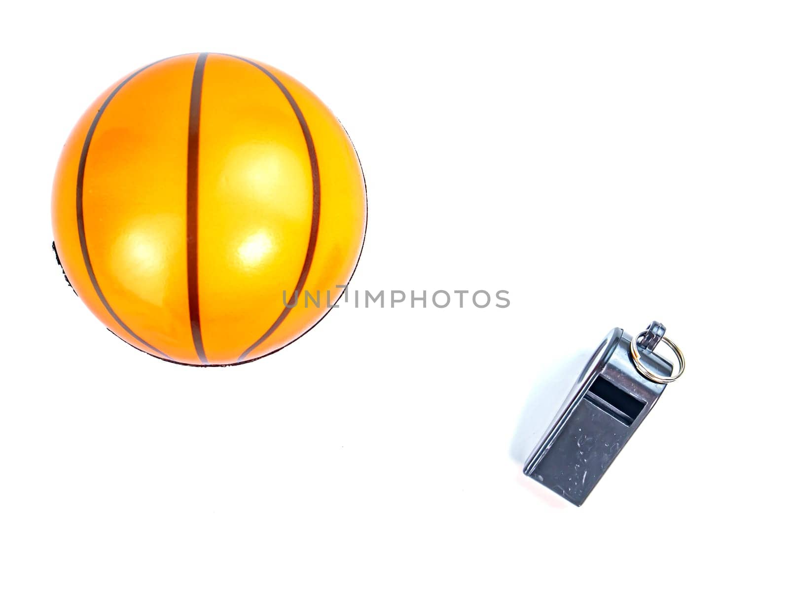 Basketball ball and referee whistle on a white background. Sport. Tote. Background image. Place for text.