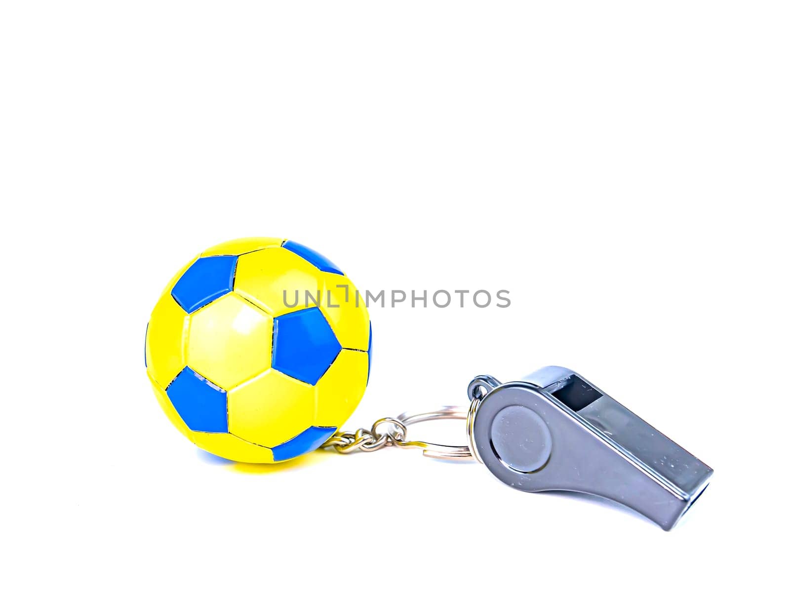Soccer ball and referee's whistle on a white background. Sport. Championship. Europe. World. Background image. Place for text.