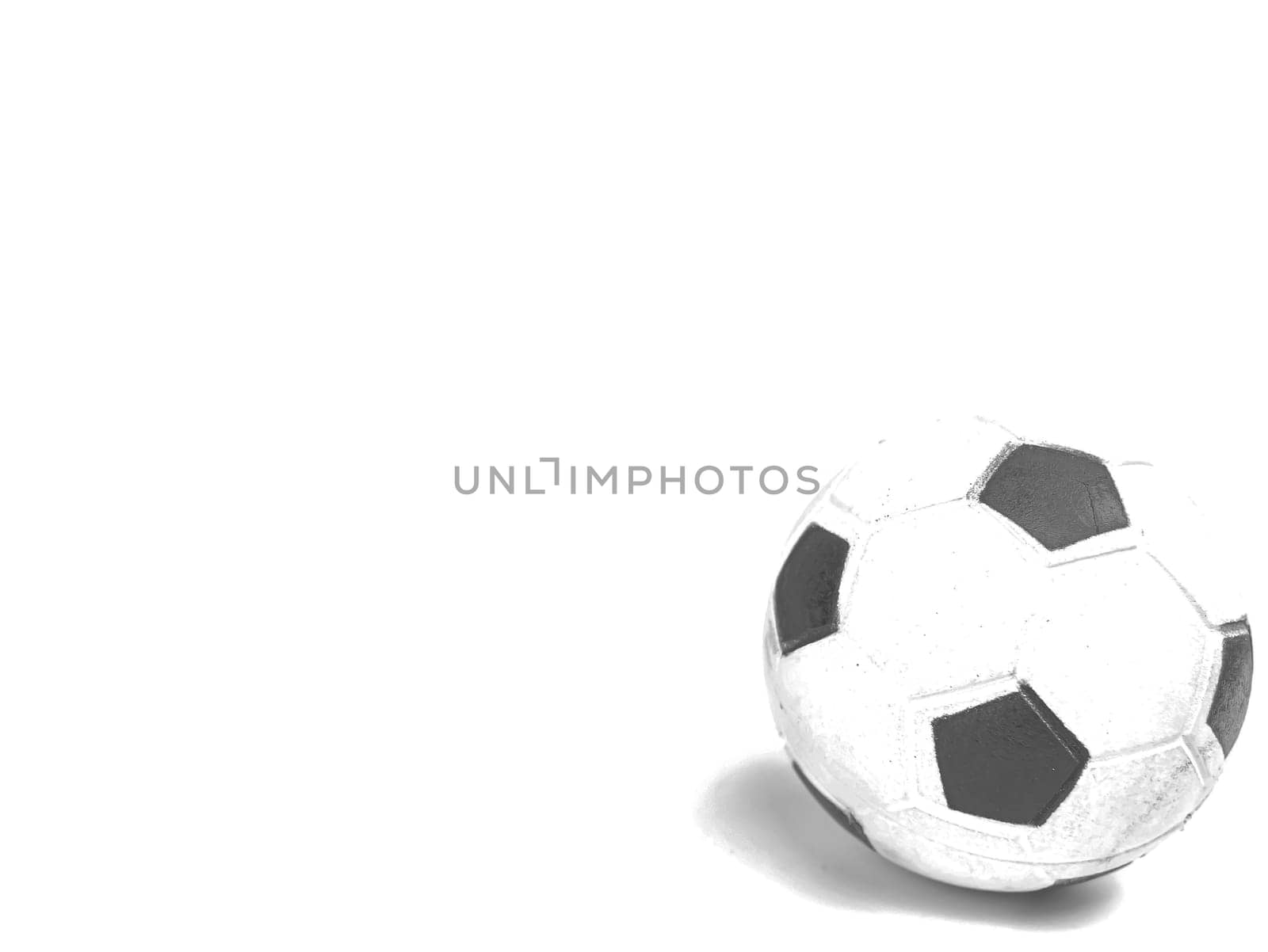 Soccer ball on a white background. Sport. Championship. Europe. World. Background image. Place for text. Black and white image.