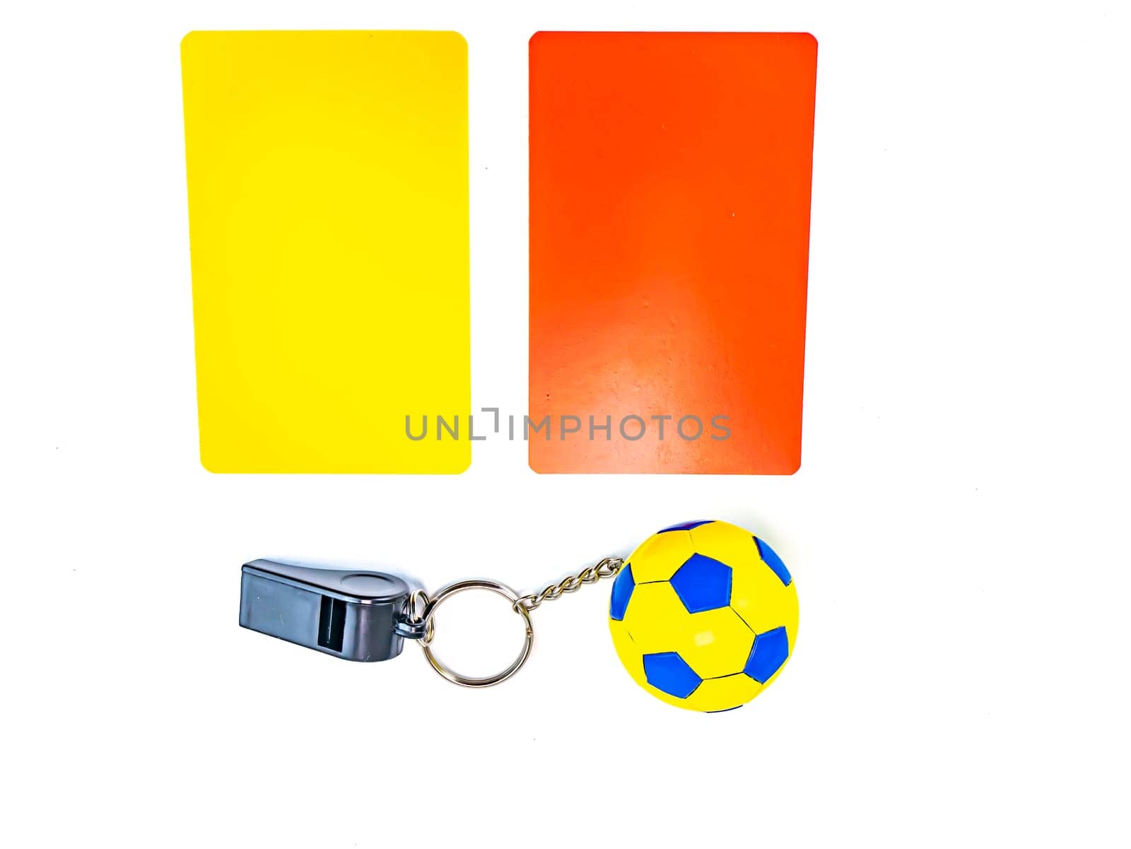 Soccer ball and referee whistle with cards on a white background. Sport. Championship. Europe. World. Background image. Place for text.