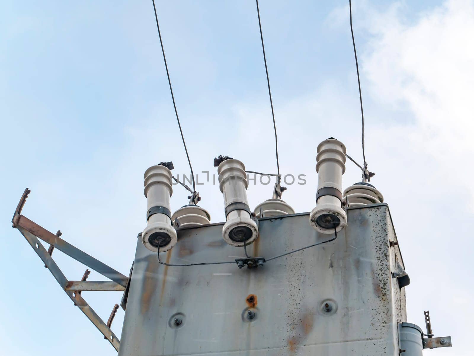 High-voltage power line transformer with wires. Technology. Industry. Place for text. Background image.