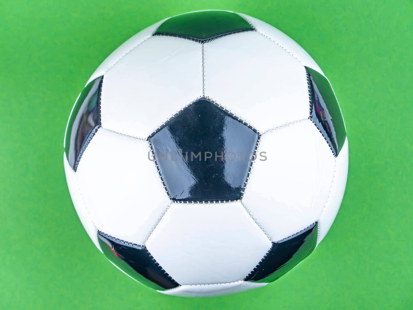 Soccer ball on a green background. Sports Championship. Europe. World. Free space for text. Background image.