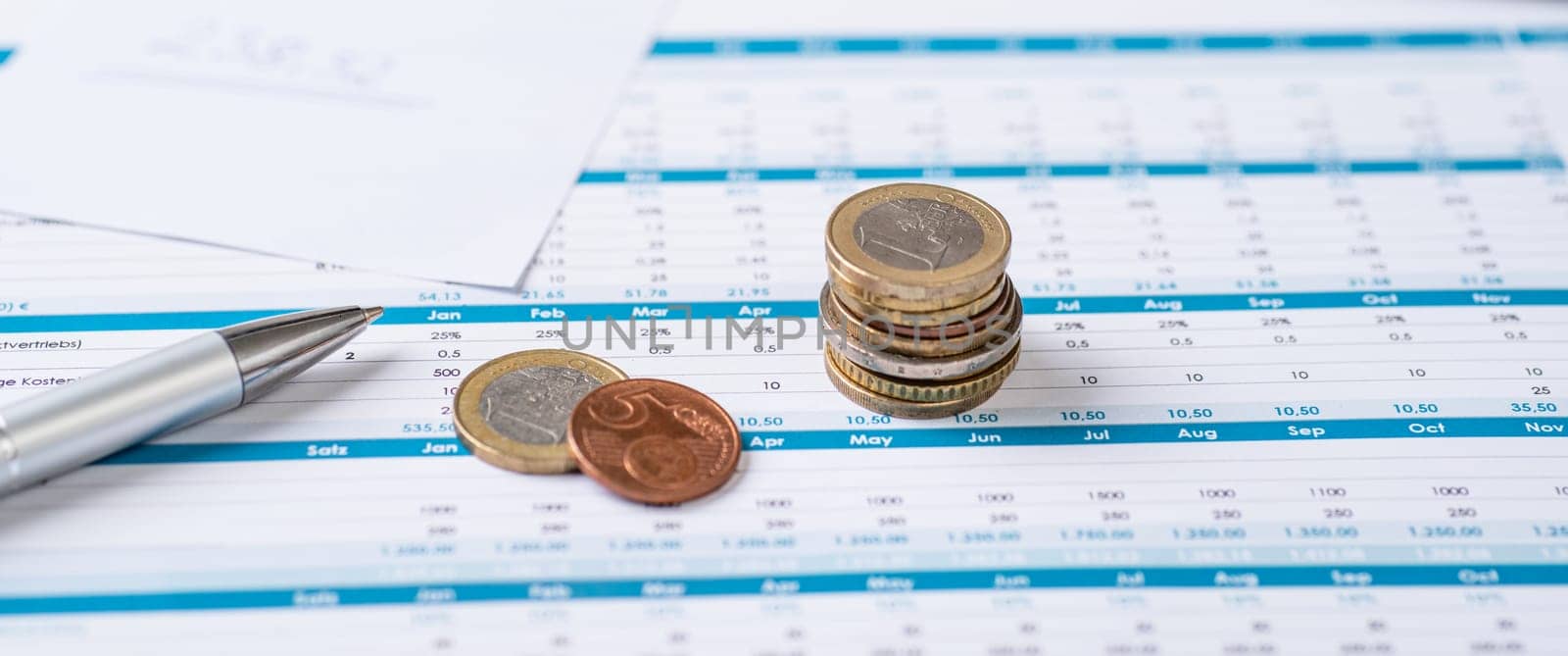 Financial documents with coins