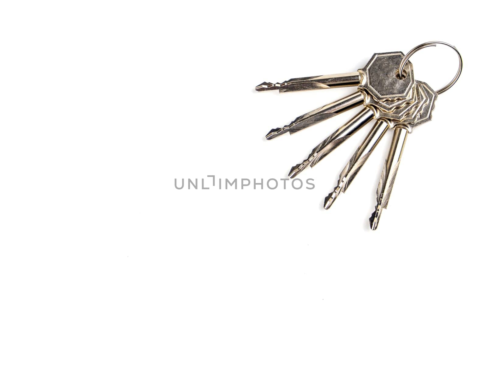 A bunch of keys to a door lock on a white background. Security. Security. Place for text. Technology.