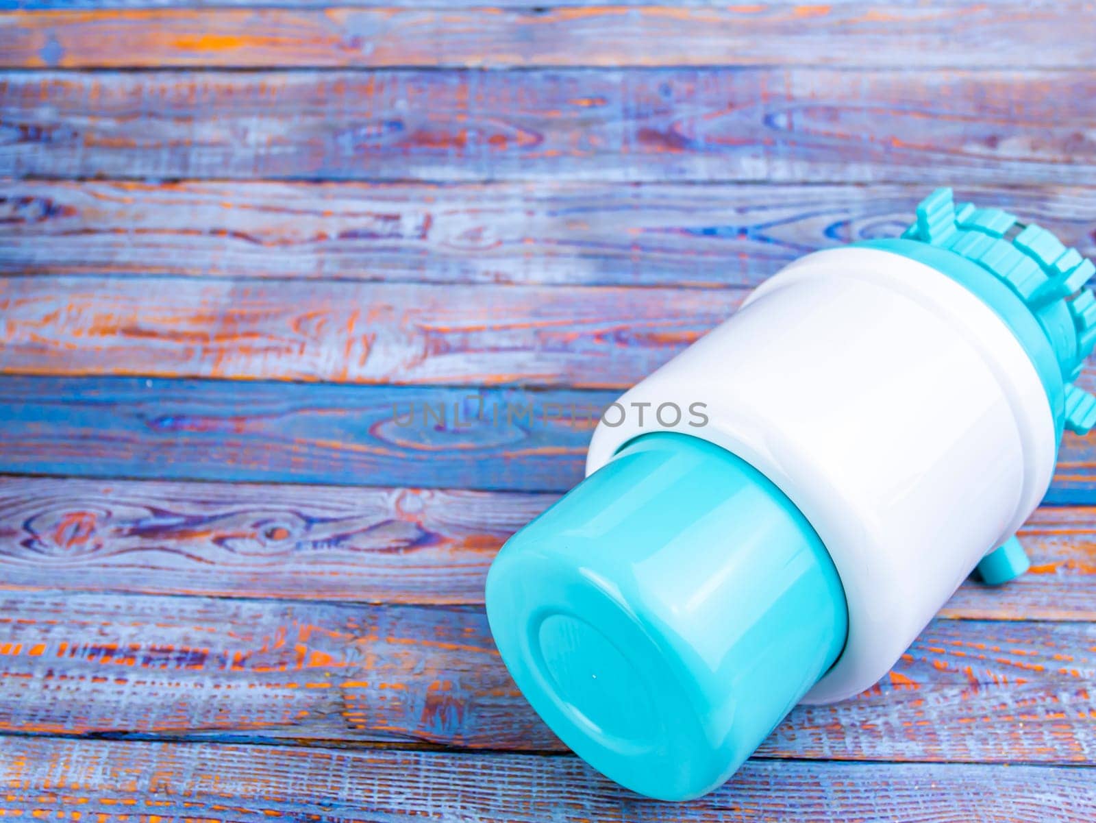 Pump for a bottle of water on the table. Place for text. Background image. Technology.