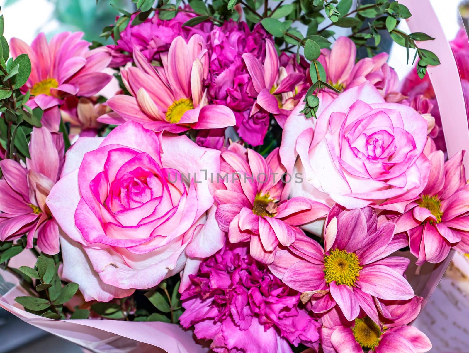 Festive bouquet of garden flowers of pink roses and pyrethrum. Mothers Day. Birthday. Bridal bouquet. Day of Remembrance. International Women's Day. Place for text. Background image. Advertising.