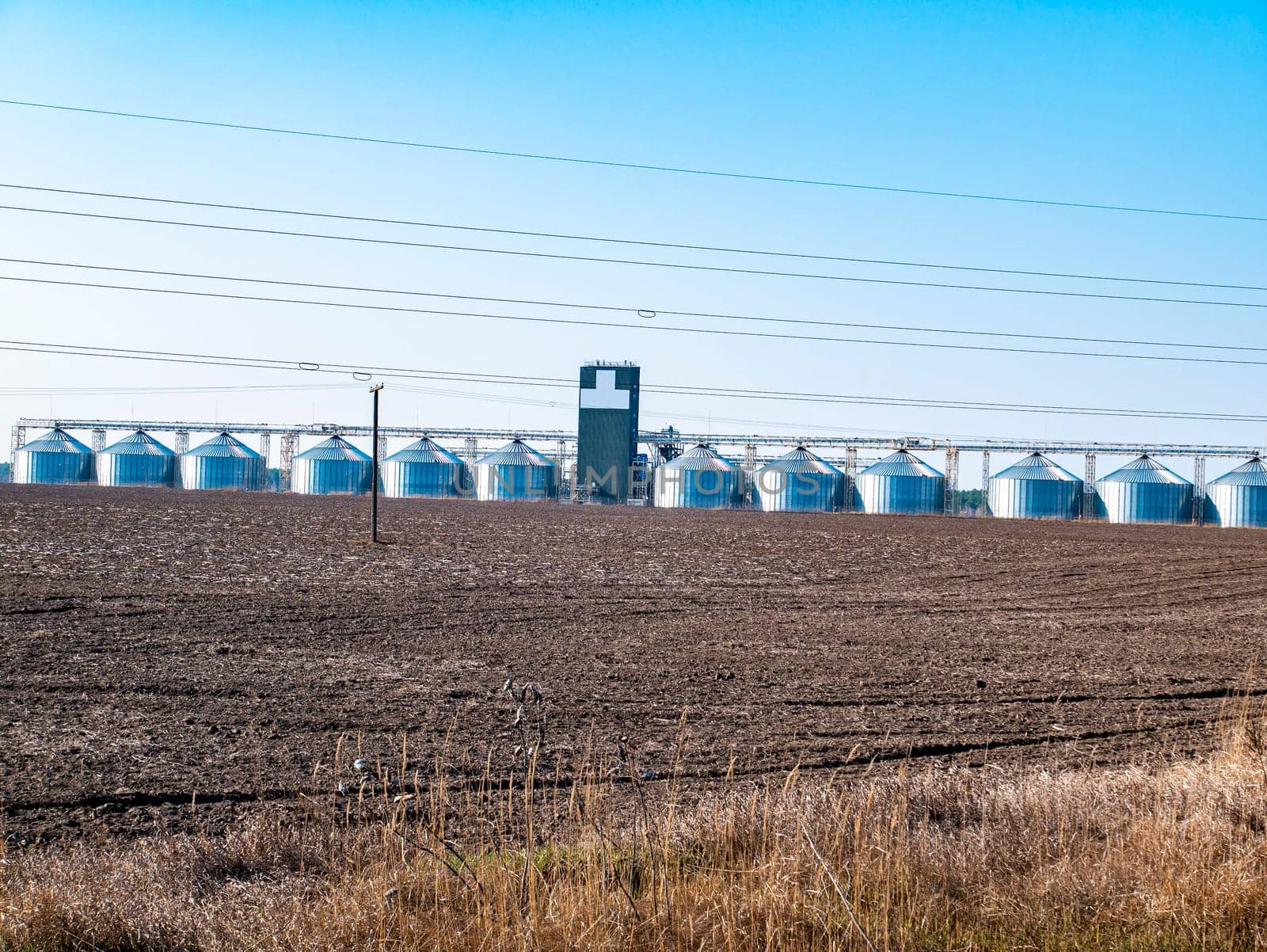 Metal containers for storage elevator on the horizon. Industry. Place for text. Background image.