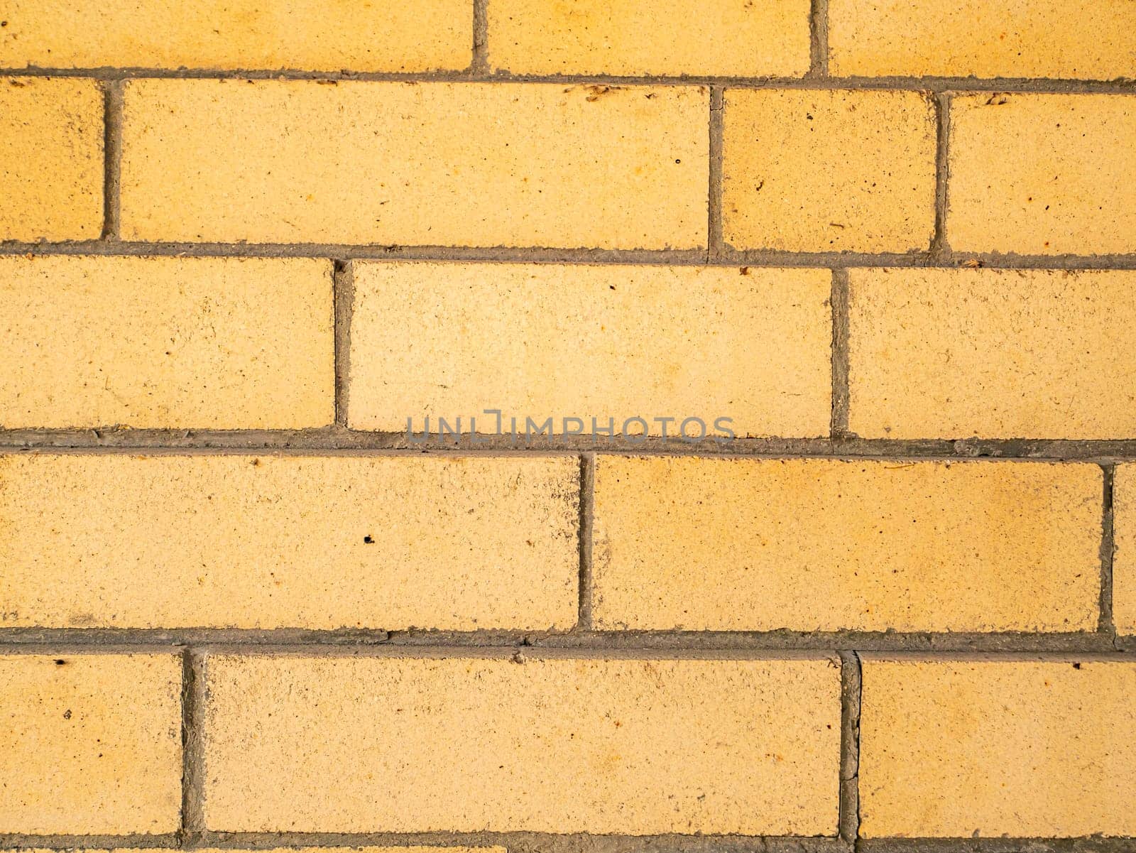 Texture of beige brick wall with place for text. Background image. Free place. Building sector.