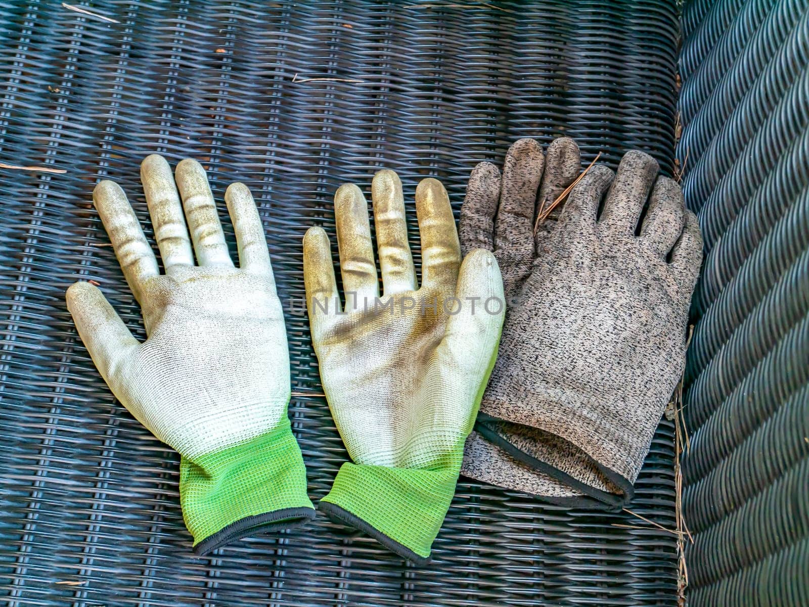 Dirty rag gloves of a gardener after work. Place for text. Background image. Tool.