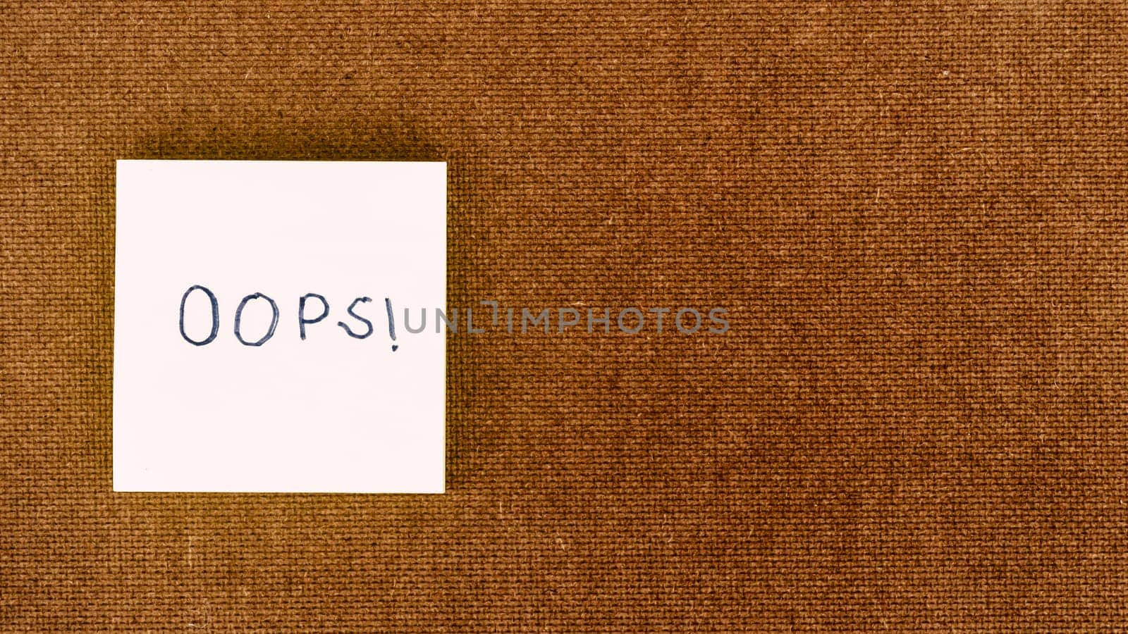 OOPS! Written on sticky notes. Mistake Learning, wrong, blooper, error regret sayings background. Fault, defect, careless lesson correction and reconciliation thought concept. Table top view. Flat Lay