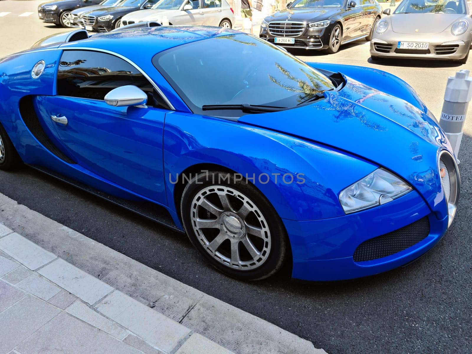 Monte-Carlo, Monaco - August 1, 2021: Blue Bugatti Veyron 16.4 Luxury Supercar Parked In Front Of The Monte-Carlo Casino In Monaco On The French Riviera, Europe. Closeup Side View