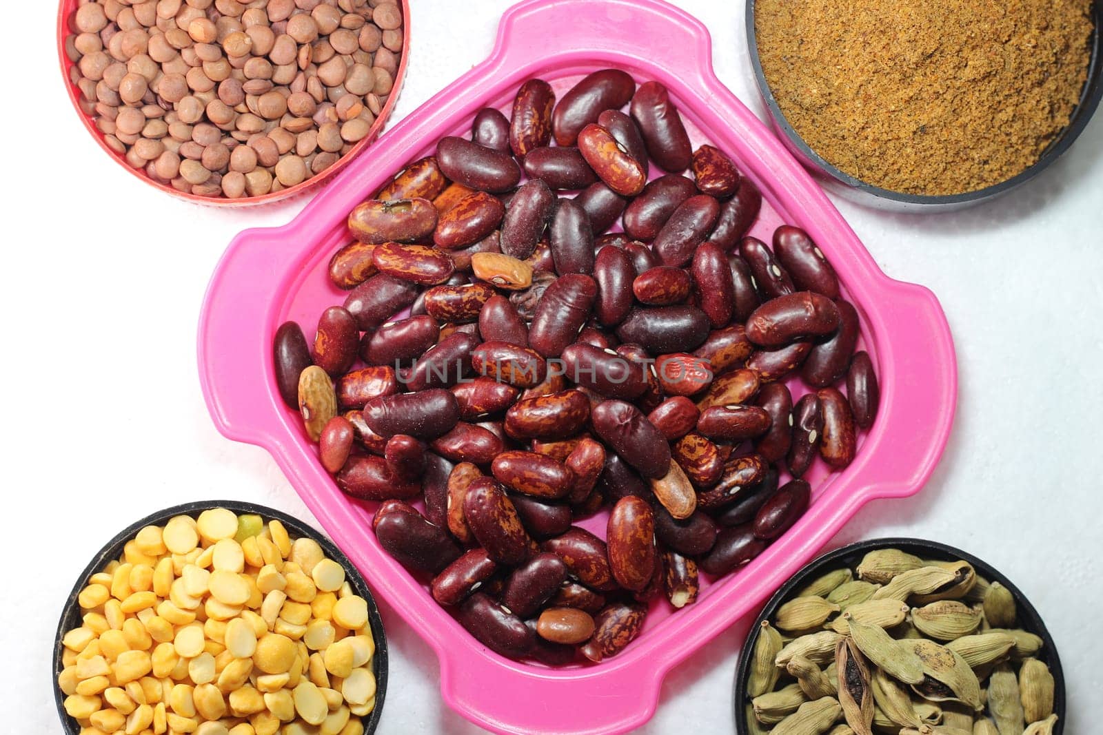 Top view of assortment of cereals, and cardamom. Collection of different spices and cereals.