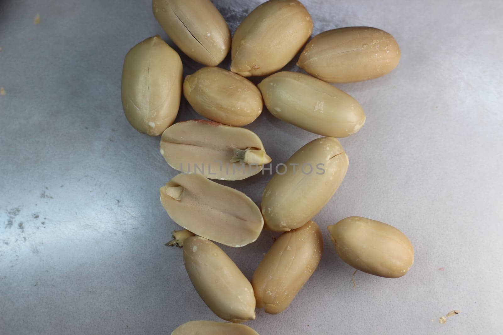 Peeled peanut with shells. Food background of peanuts