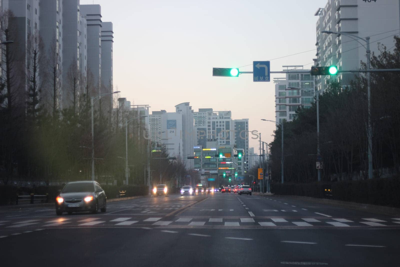 Incheon, South Korea- January 2021: Highway road with heavy traffic and cityscape of a modern city