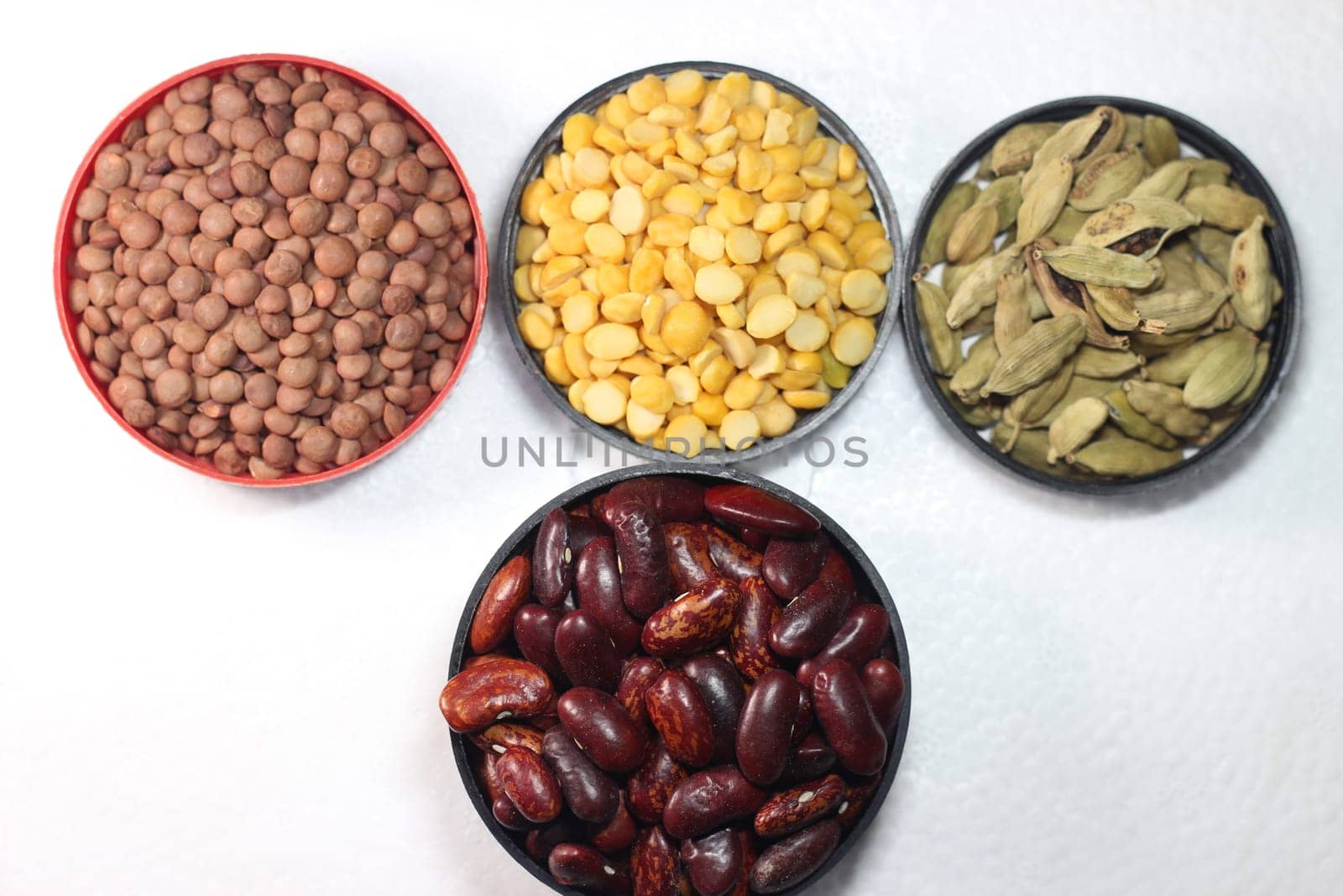 Top view of assortment of cereals, and cardamom. Collection of different spices and cereals.