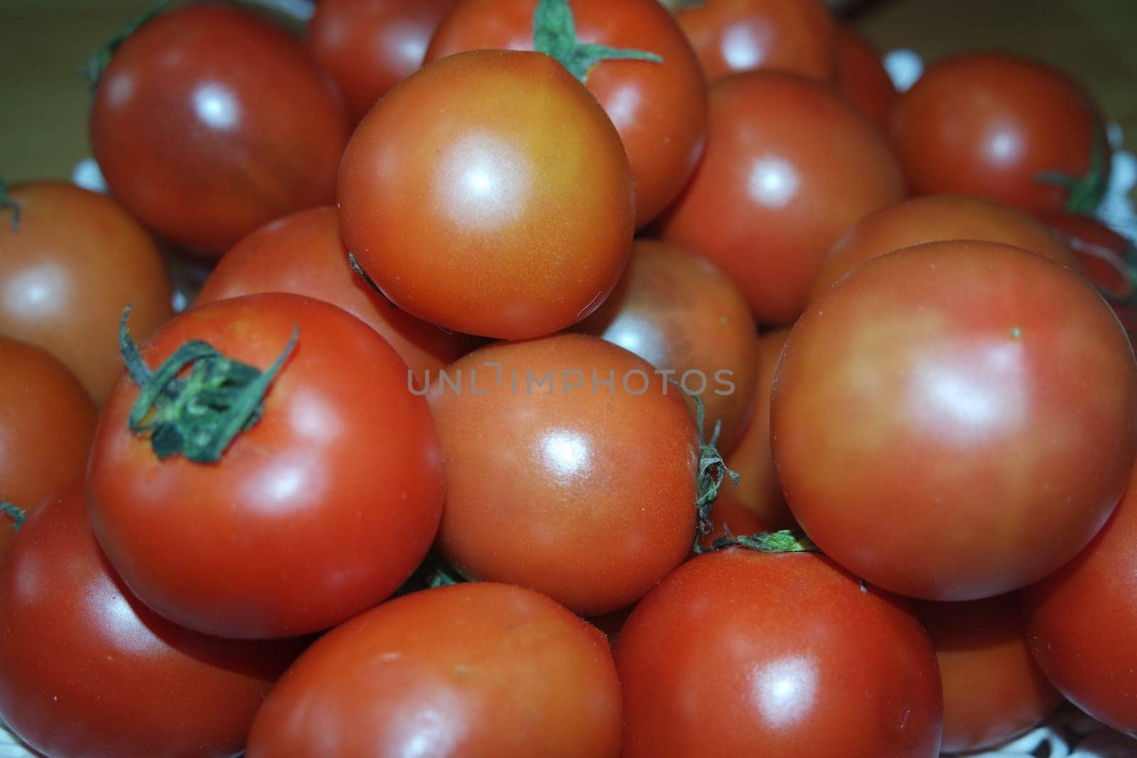 Close-up view of red tomatoes in market for sale. A fruit background for text and advertisements