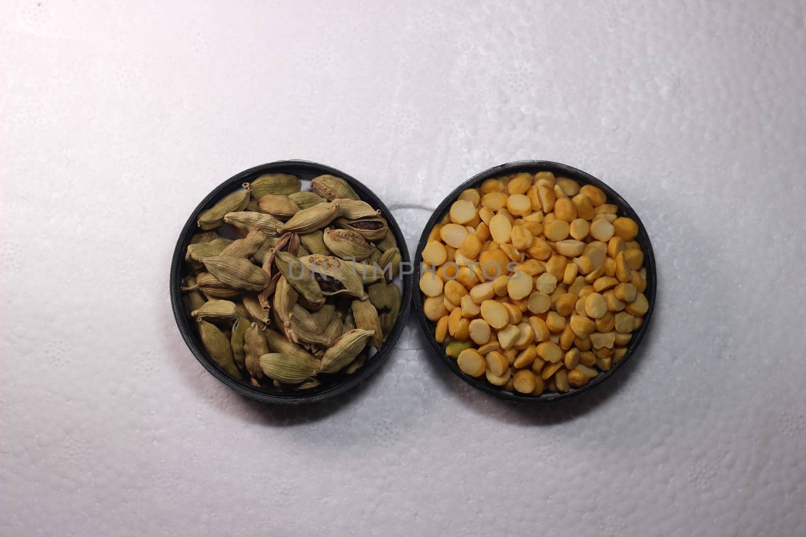Top view of assortment of cereals, and cardamom. Collection of different spices and cereals.