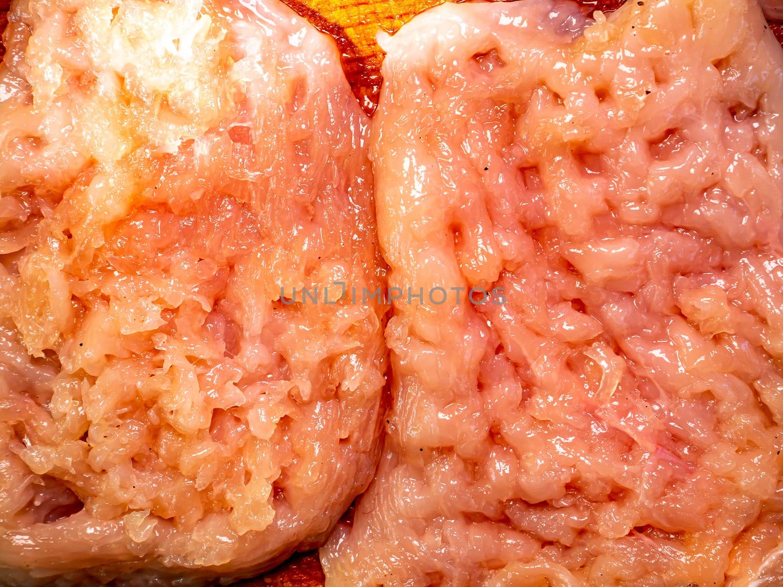 Raw meat chop on a cutting board. Kitchen tool. The process of preparing a meat chop. Home kitchen. Recipe. Food menu. Background image.