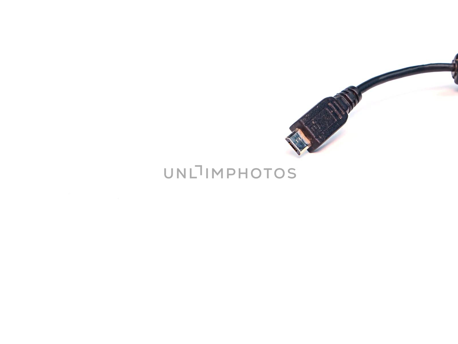 Black usb cord for transferring digital data on a white background. Digital data transmission technologies. Computer connection. Charging mobile devices. USB cord for charging the phone.