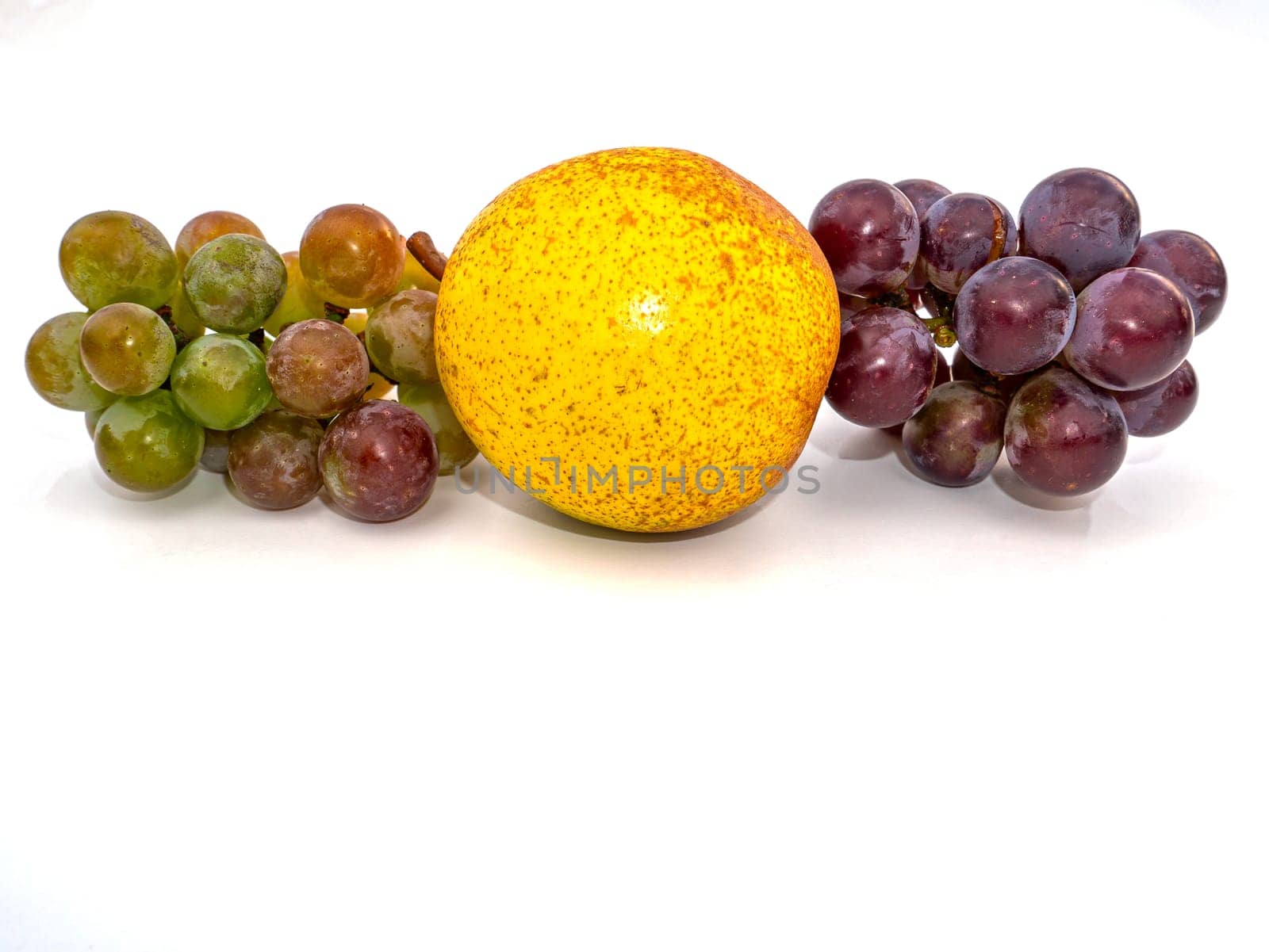 Harvest grapes berries on pears fruits white background. Grape juice. Pear juice. Winemaking. Take a pear. Fruit shop showcase. Grape gardening. Agriculture. Place for text. Dried fruits.