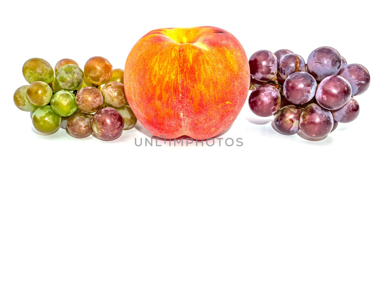 Fruit peach and grapes on a white background. Harvesting. Red peach. Bunch of grapes. Fruit juice. Food photo. Agriculture. Winemaking. Showcase of a fruit shop. Place for text. Poster.