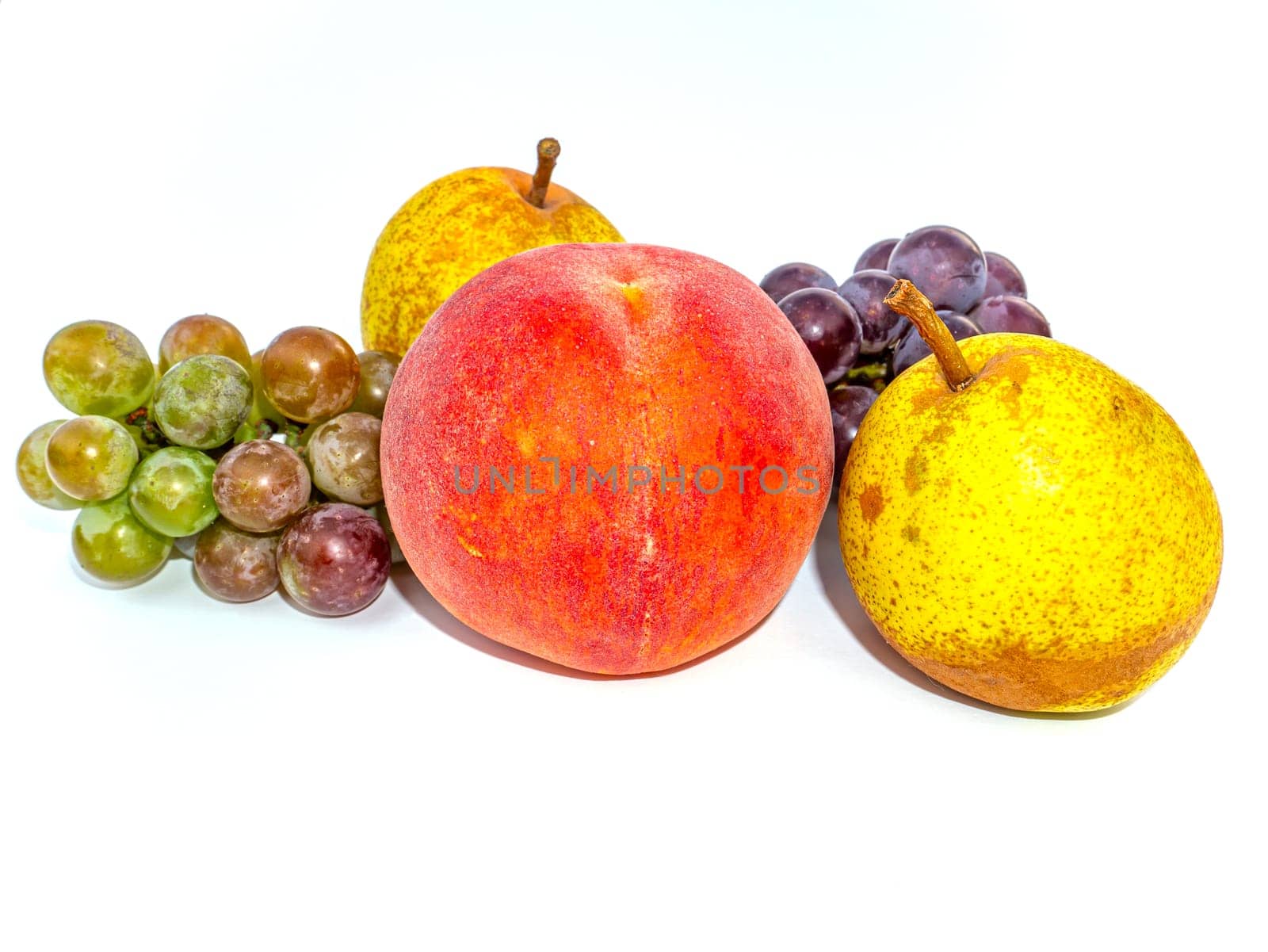 Fruit peach and grapes with pear on a white background. Harvesting. Red peach. Bunch of grapes. Garden pear. Fruit juice. Food photo. Agriculture. Winemaking. Showcase of a fruit shop. Place for text.