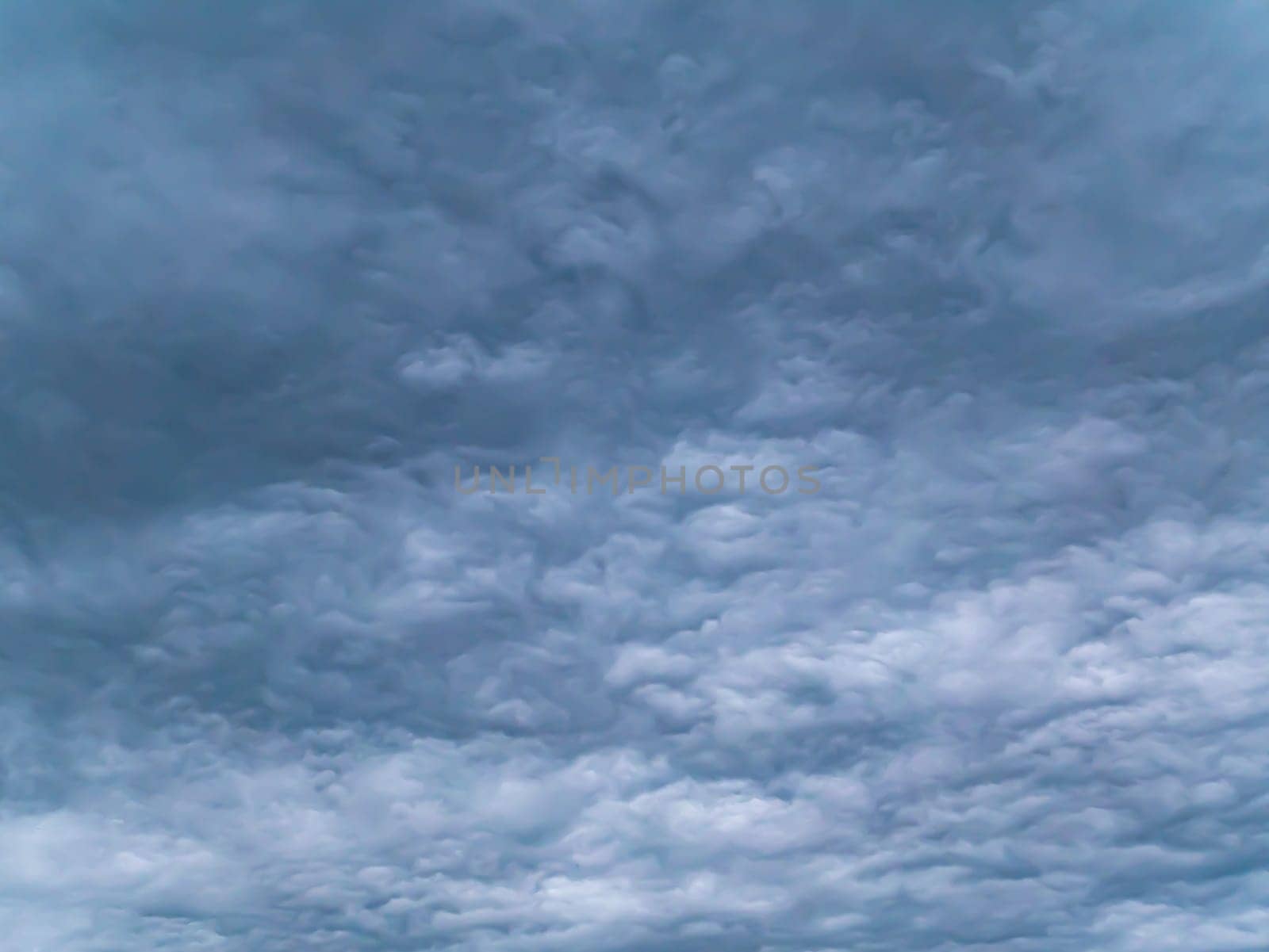 Cloudy landscape of stormy sky before rain. Weather. Non-flying weather. Hurricane. Thunderclouds. A storm warning. The approach of the apocalypse. Forecast by weather forecasters. Background.