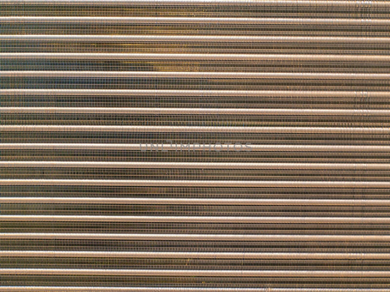 Aluminum radiator for engine cooling and car air conditioning. Refrigeration system cooling condenser. Refrigerator evaporator. Car repair workshop. Refrigerator repair. Air conditioning system.