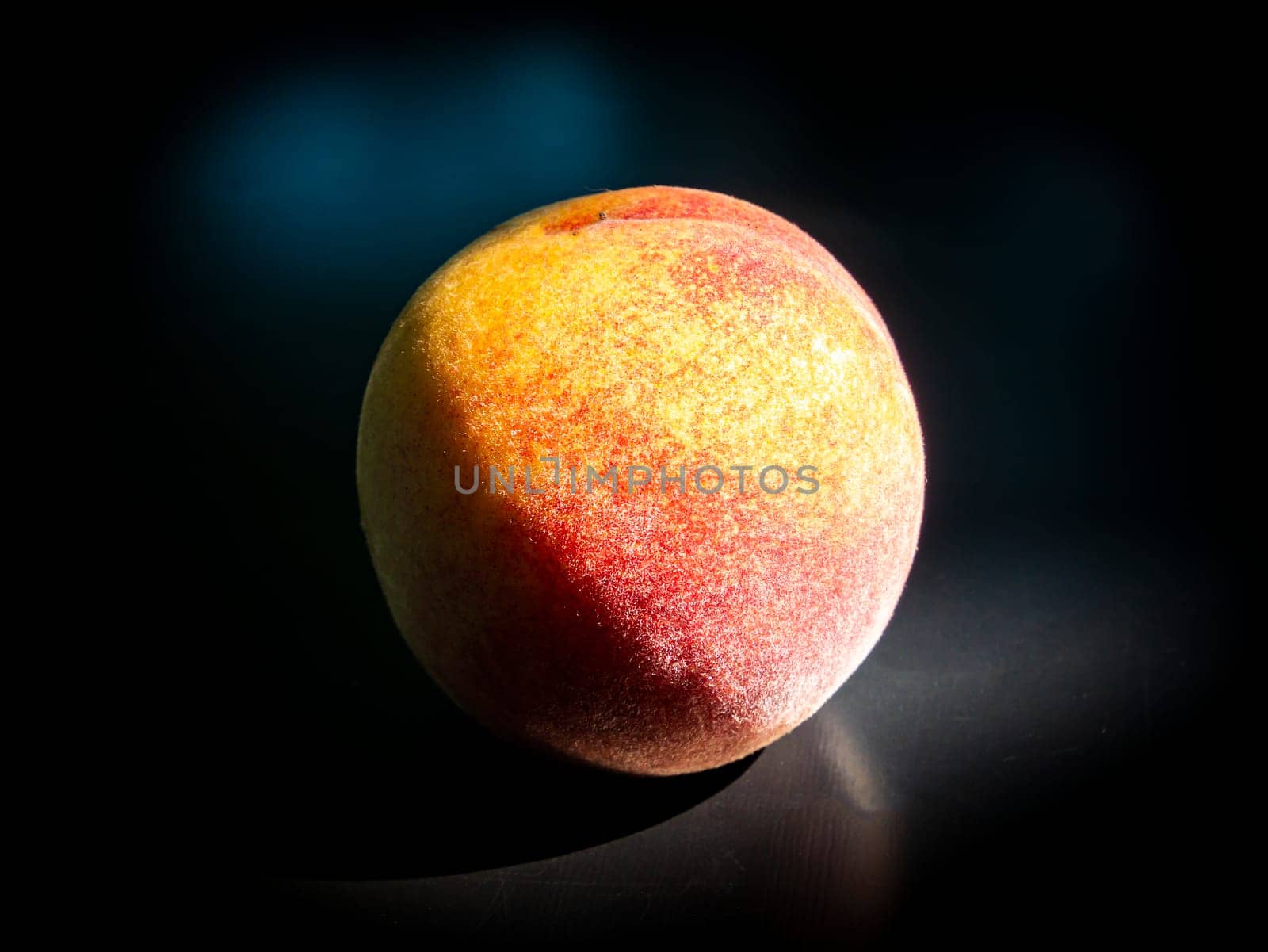 Ripe peach fruit on a black background. Food photo. Harvesting. Peach juice. Agriculture. Advertising photo of a shop window of a fruit shop. Place for your text. Background image. Template. Poster.
