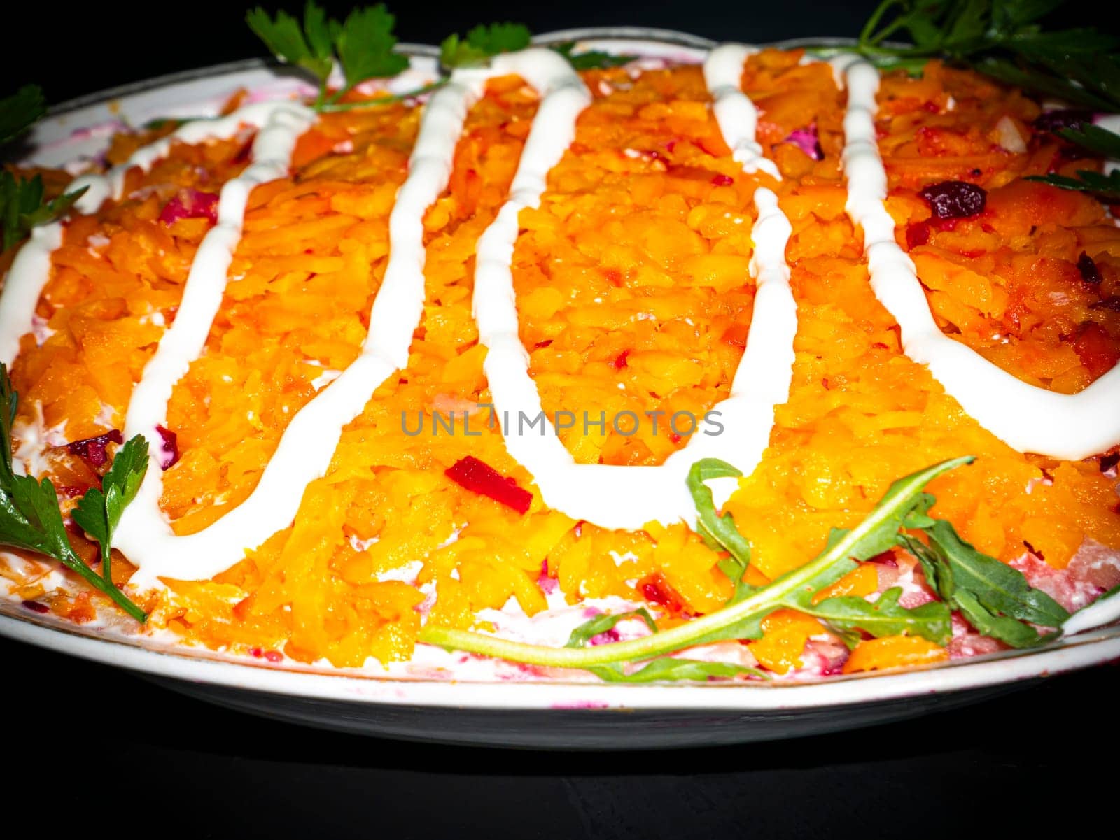 Vegetable salad with carrots decorated with parsley. Food photo. Menu of dishes. Recipe. Cooking food. Home kitchen. Vegetarianism. Healthy lifestyle. Place for your text. Template.