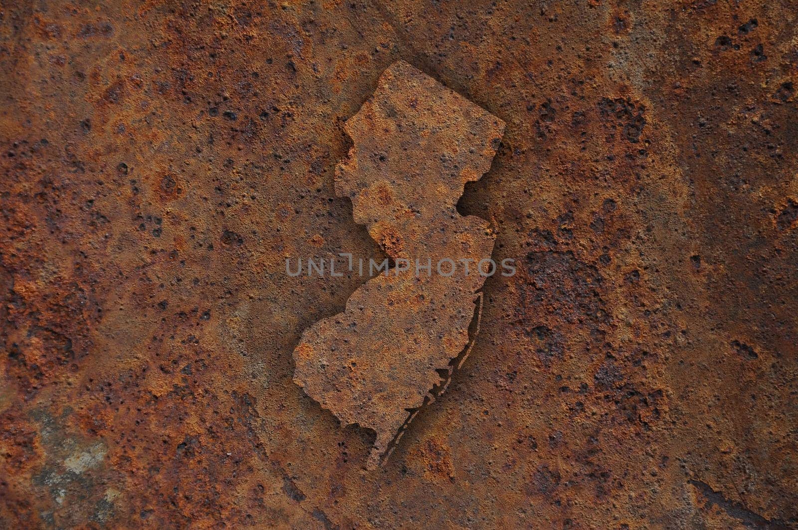 Map of New Jersey on rusty metal