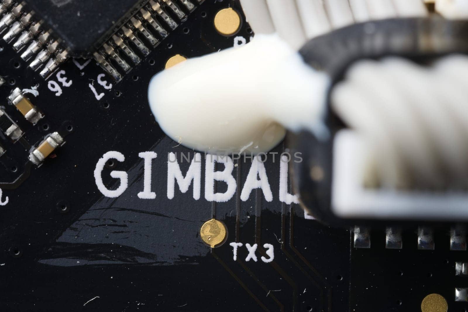 Super macro close up of gimbal area on an electronic drone circuit board. Modern technology and components, these drive a camera stabilization device.