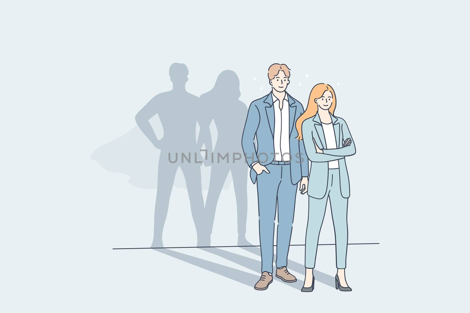 Successful cooperation and business team concept. Young man and woman business people partners standing together with big hero superman shadows on wall meaning strength of unity