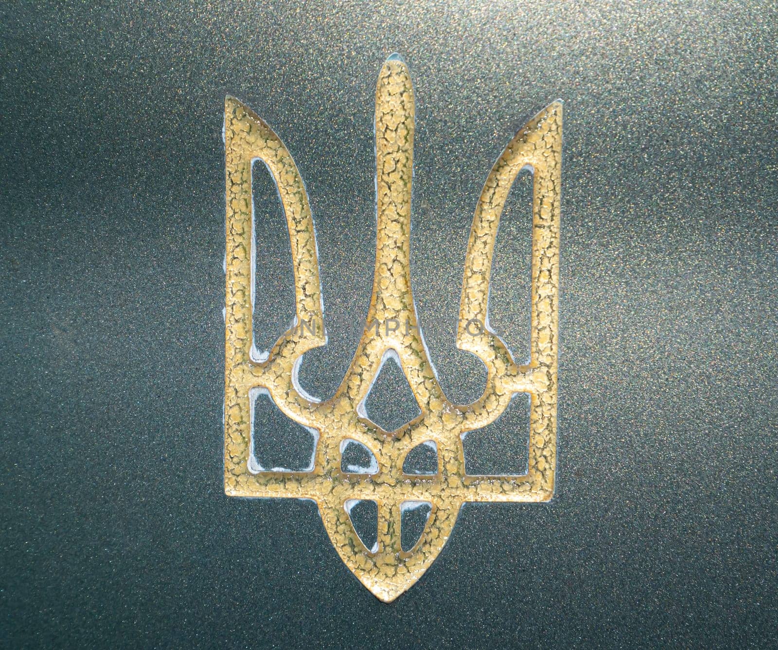 Golden coat of arms of Ukraine Trident on green marble. Ukrainian standard. Background image. Place for your text. Politics. Geography.