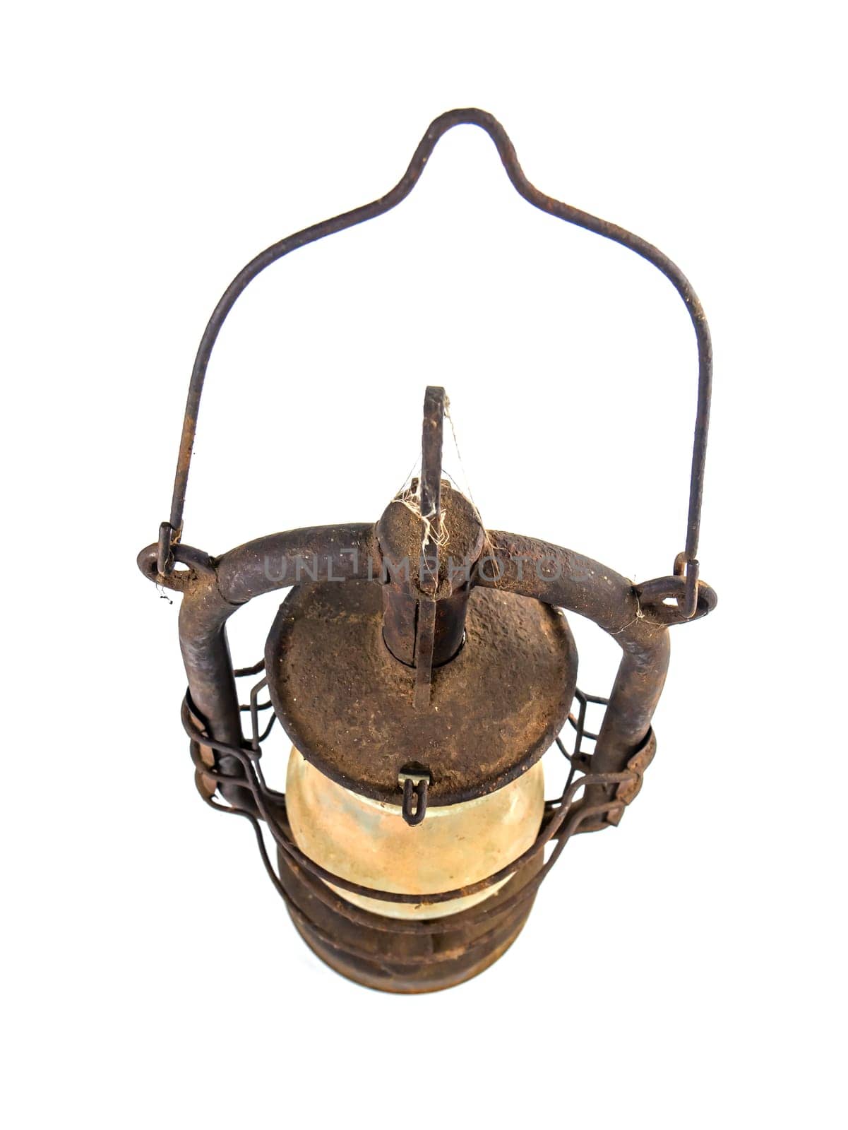 Old rusty kerosene lamp on a white background. Lighting equipment. Roofing lamp. Retro style. White background. Background image. Place for text.