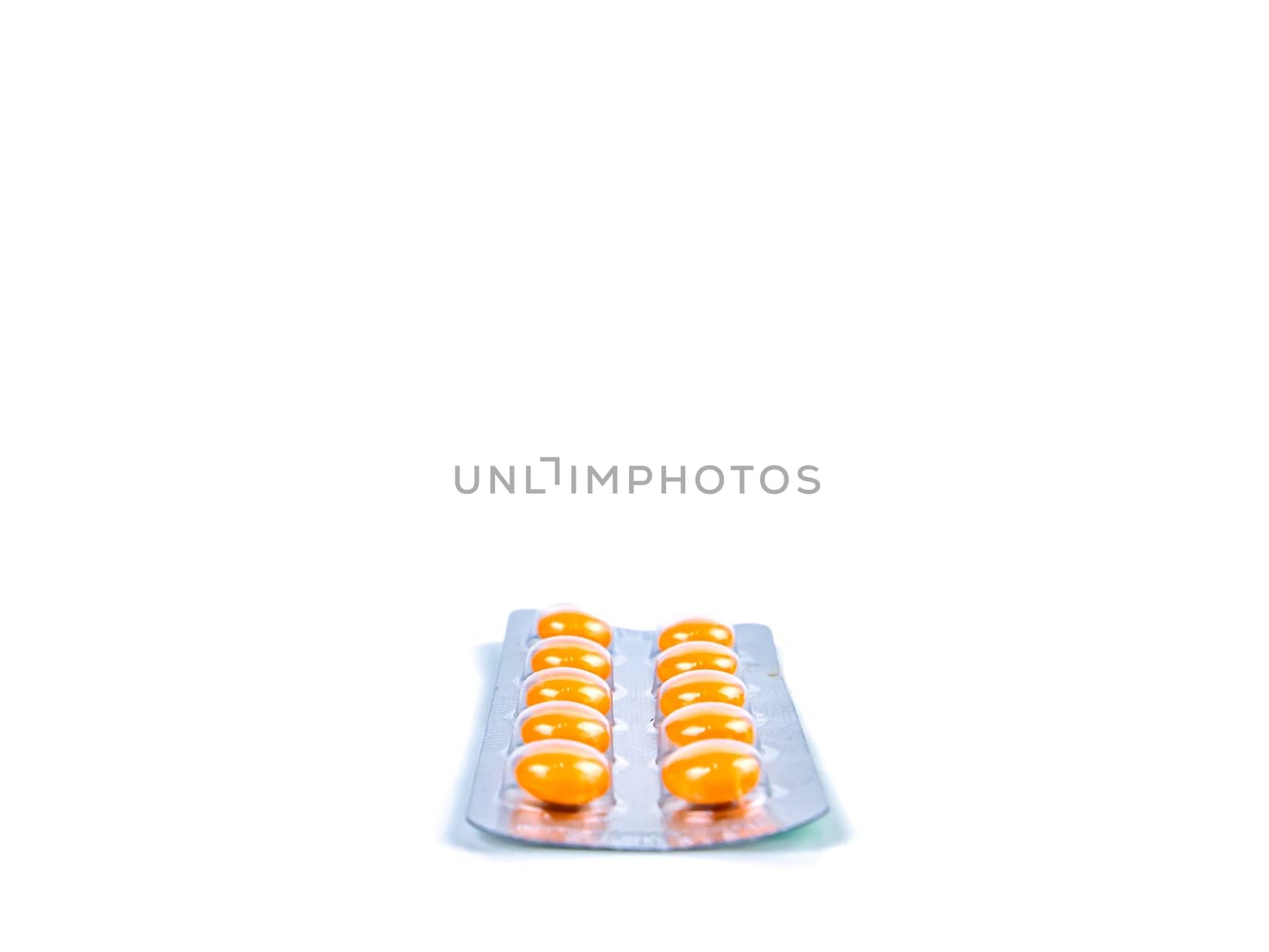 Medical medicine in pills on a white background. Pharmacy drugs in tablets. Pharmacology. Medical medicine in capsules. Pharmacy capsules for human treatment. Place for your text. Drugs in pills.
