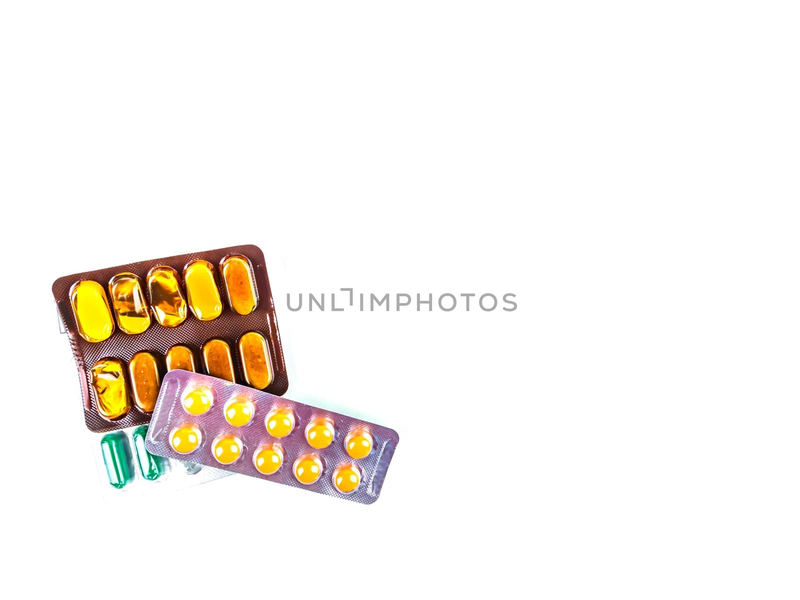 Medical medicine in pills on a white background. Pharmacy drugs in tablets. Pharmacology. Medical medicine in capsules. Pharmacy capsules for human treatment. Place for your text. Drugs in pills.