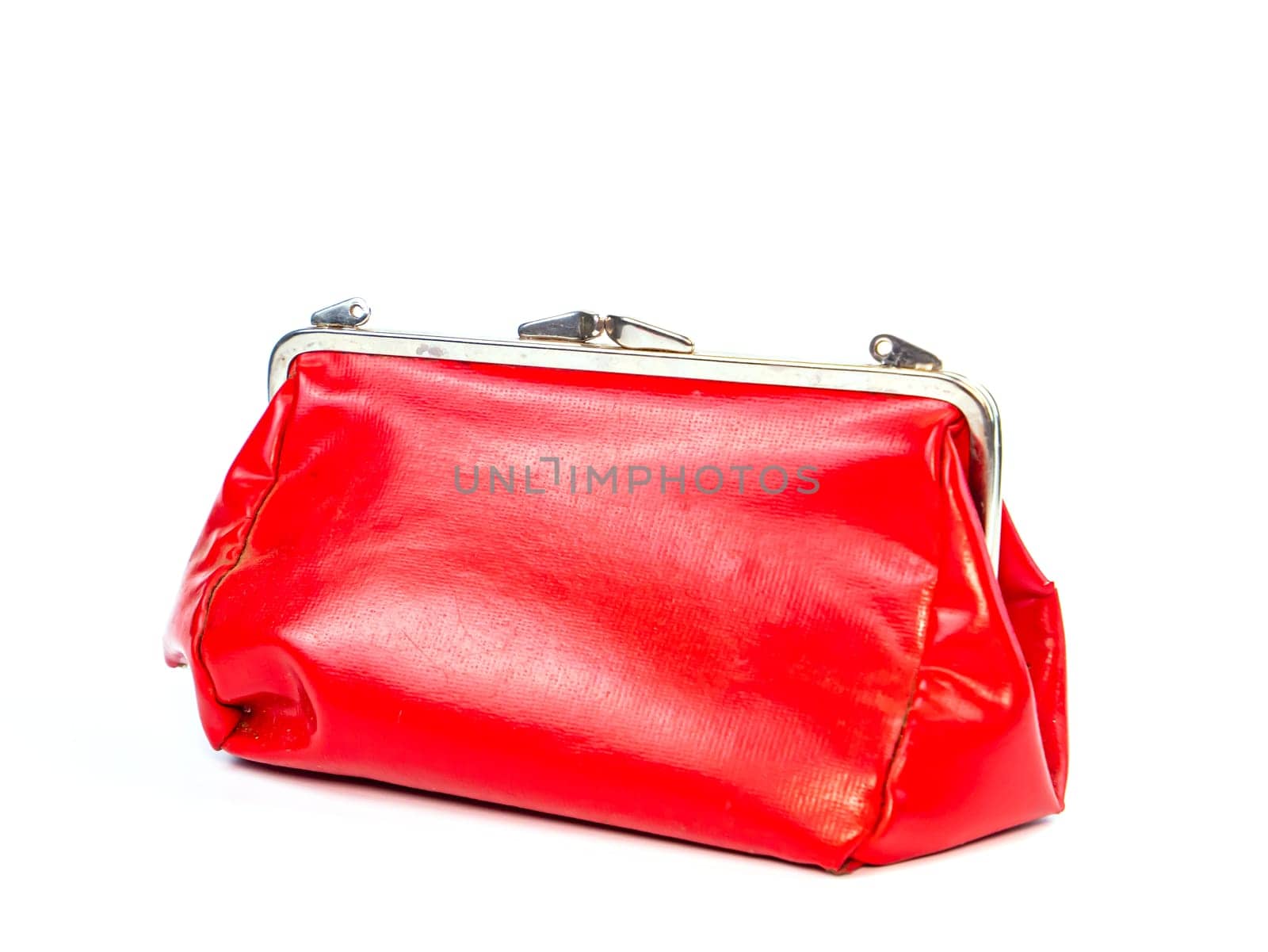 Red female cosmetic bag on a white background. Handbag. Women's cosmetic bag. Beauty and fashion. Background image. place for text.