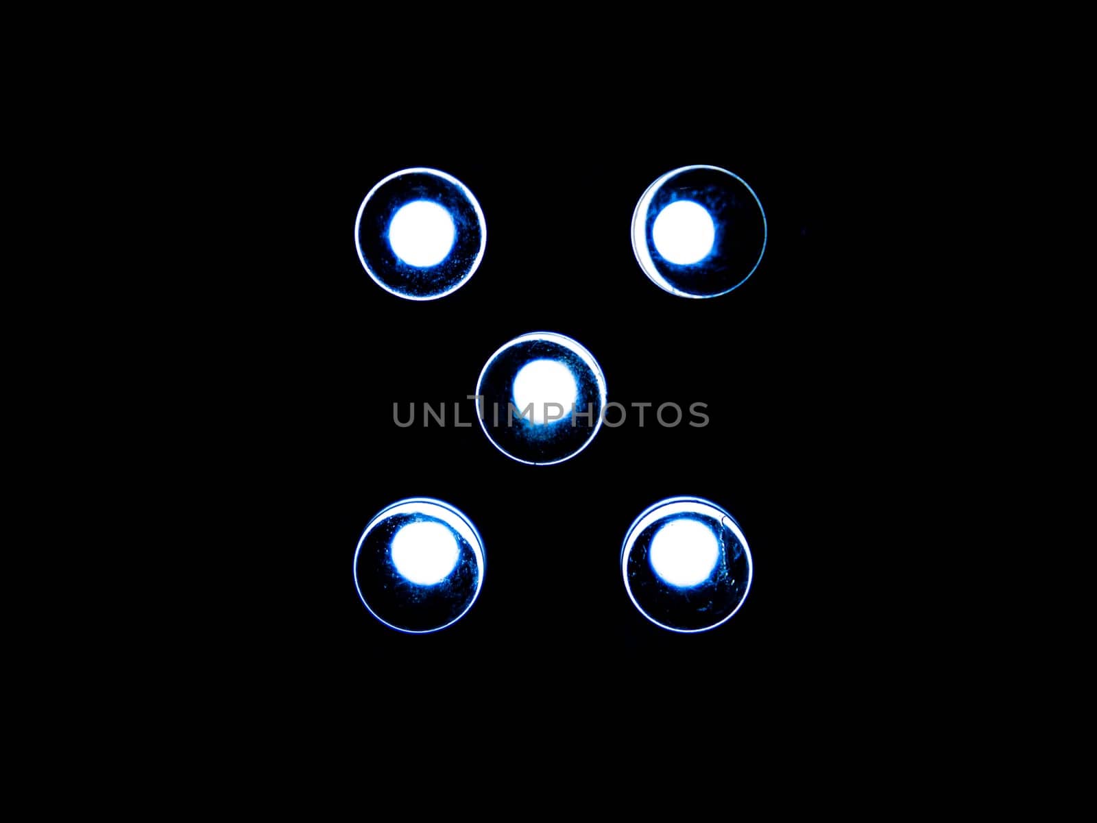 White led electric bulbs glow in the dark. Led light bulbs at night. Night illumination. Electric light. Black background. Background image. Place for text. Technology. Poster.