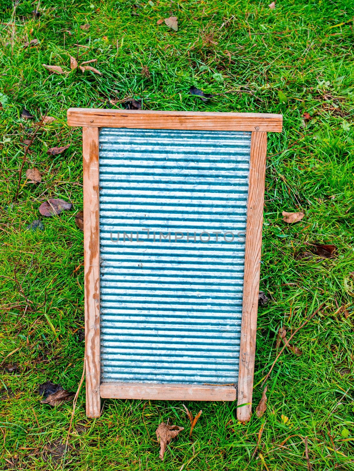 Retro household board for hand washing clothes. Board for hand washing clothes. Housekeeper. Laundry soap. Soapy water. Wooden frame. Washer. Place for your text. Womens homework.