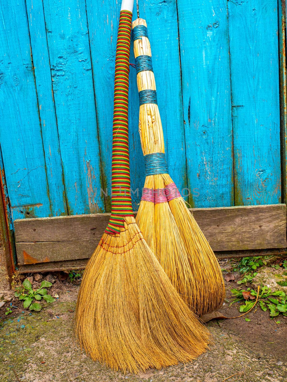 Wicker broom made of sorghum for indoor sweeping. Broom for sweeping the floor. House cleaning. Cleaning of office premises. Cleanliness and tidiness. Cleaning of the territory. Tool.