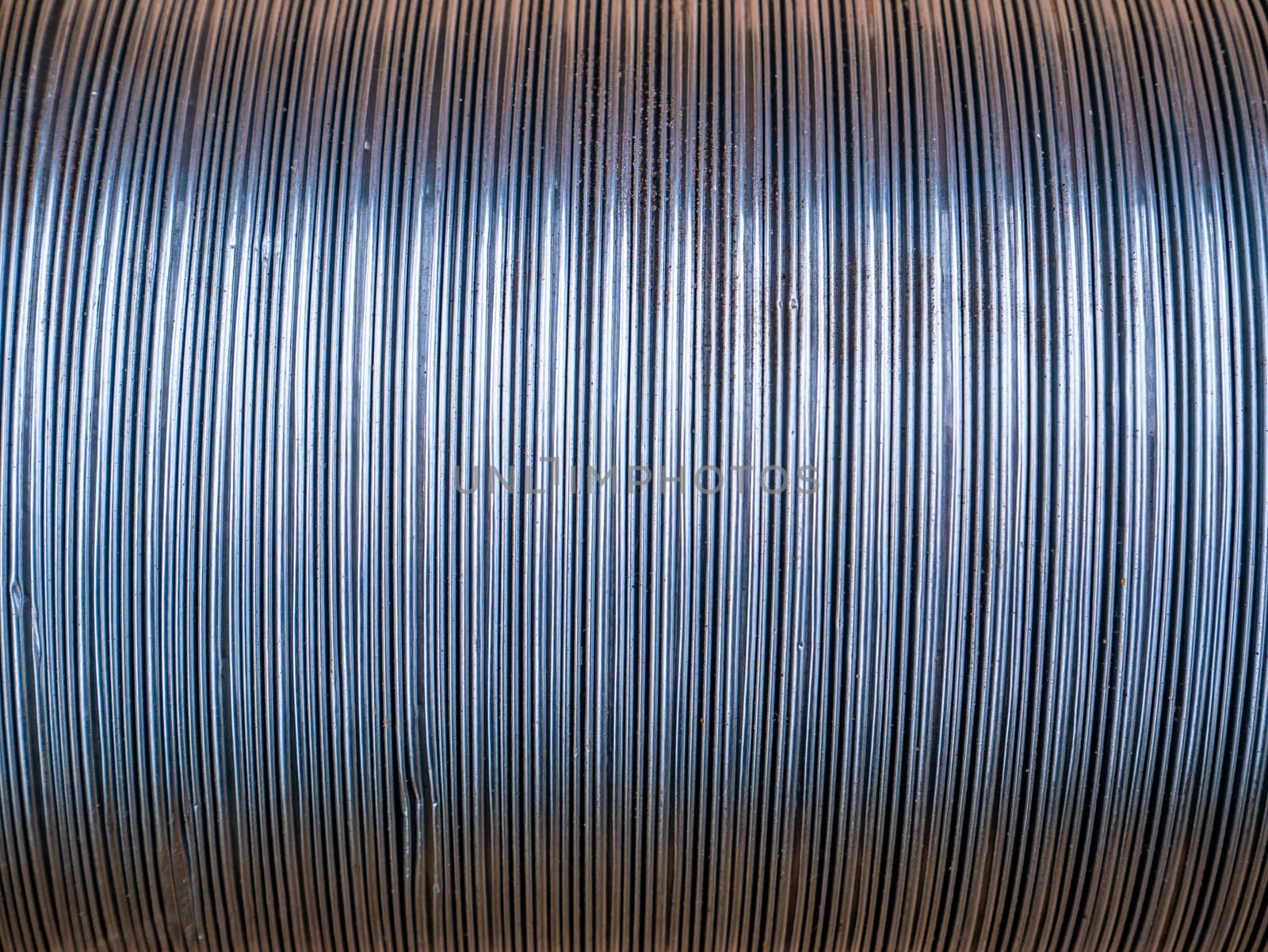 The texture of the metal corrugated ventilation pipe. Metal corrugation texture. Ventilation pipe. Hood. Embossed metal. Iron. Air conditioning duct. Intake hood air duct. Background.