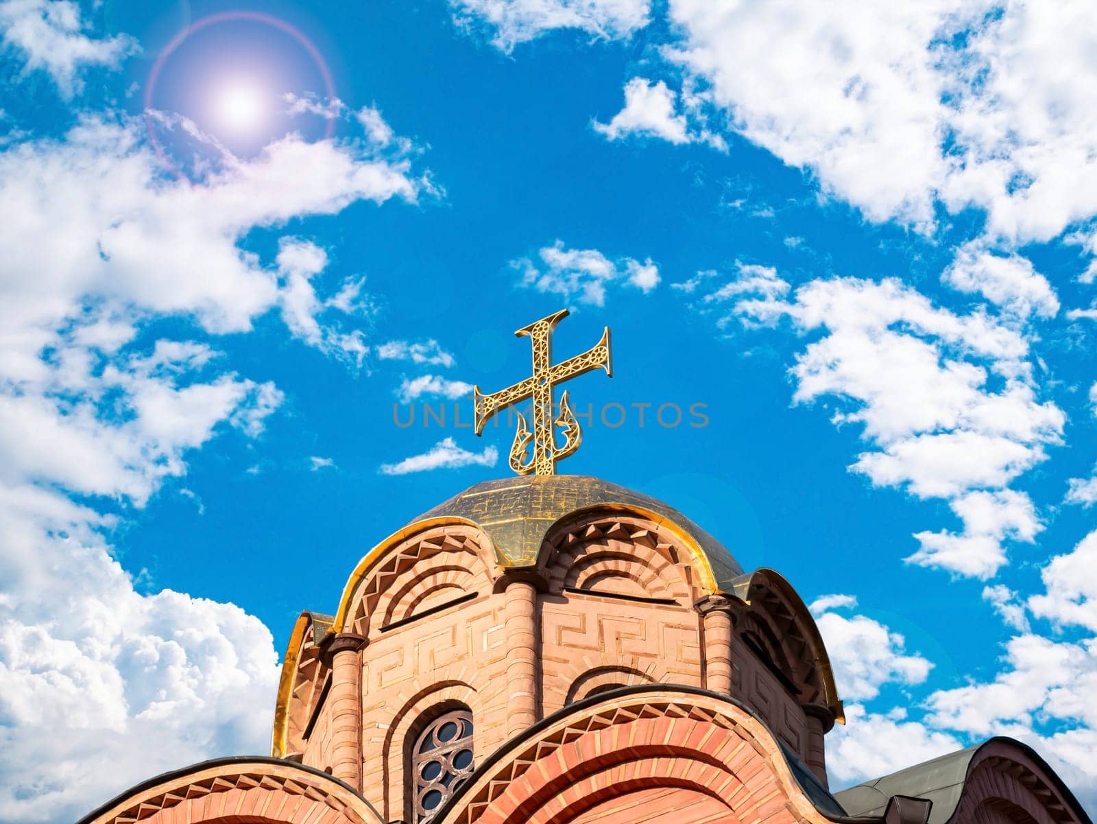 Domes with a cross of a Christian church. Christian cross. Religion and culture. Orthodox church. Blue sky. White clouds. Merry Christmas. Easter holidays. Background image.