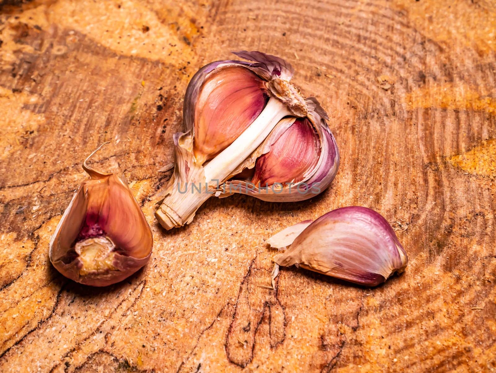 Spicy garlic vegetable on a black background. Harvest vegetables. Head of garlic. Hot seasoning. Vegetarian food. Agriculture. Background image. Food photo.