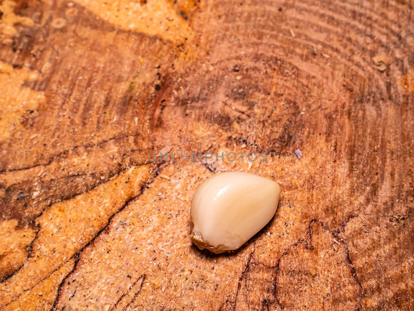 Spicy garlic vegetable on a black background. Harvest vegetables. Head of garlic. Hot seasoning. Vegetarian food. Agriculture. Background image. Food photo.