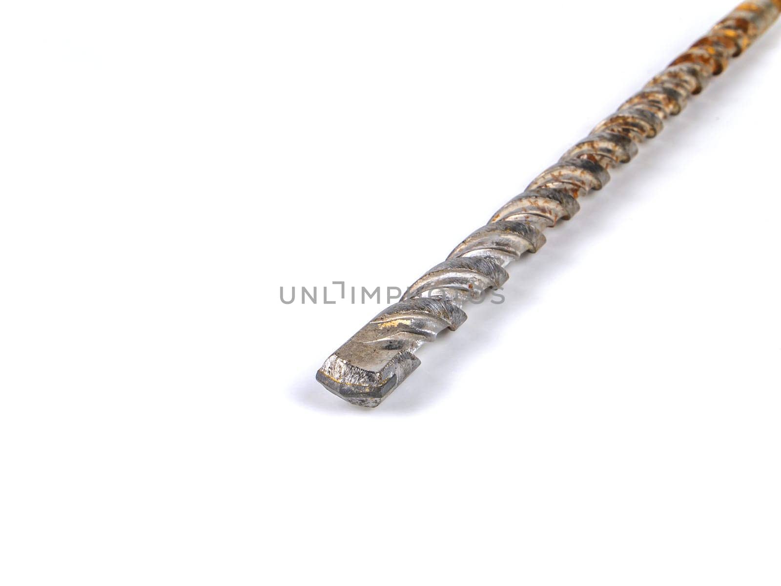 Metal drill for drilling holes on a white background. Metal drill. Drilling holes. Worker tool. Construction and repair. Builder tool. Iron material. Workshop equipment. Handicraft equipment. Master.