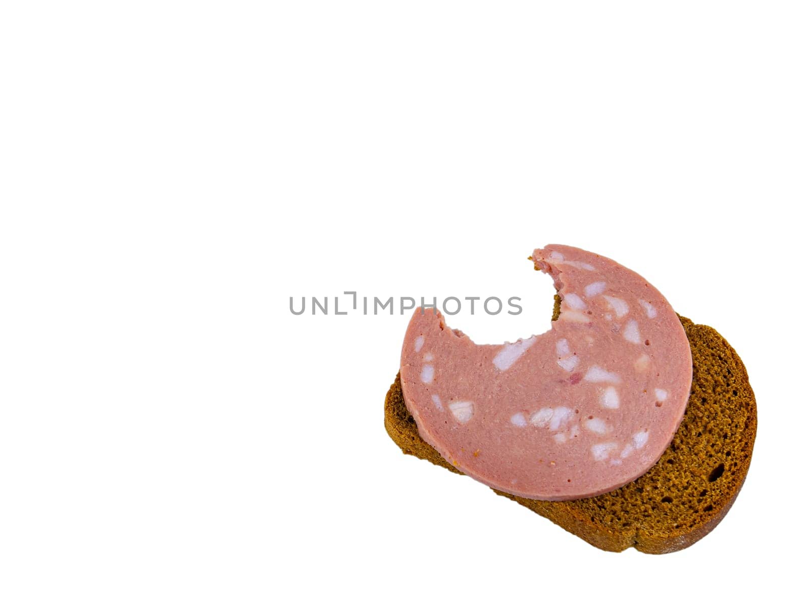 Bitten black bread sandwich with pork sausage and lard on a white plate. Black bread. Meat sausage. Pork fat. Pork product. Fatty food. Not vegetarian food. Meat dish. Home kitchen. White background.