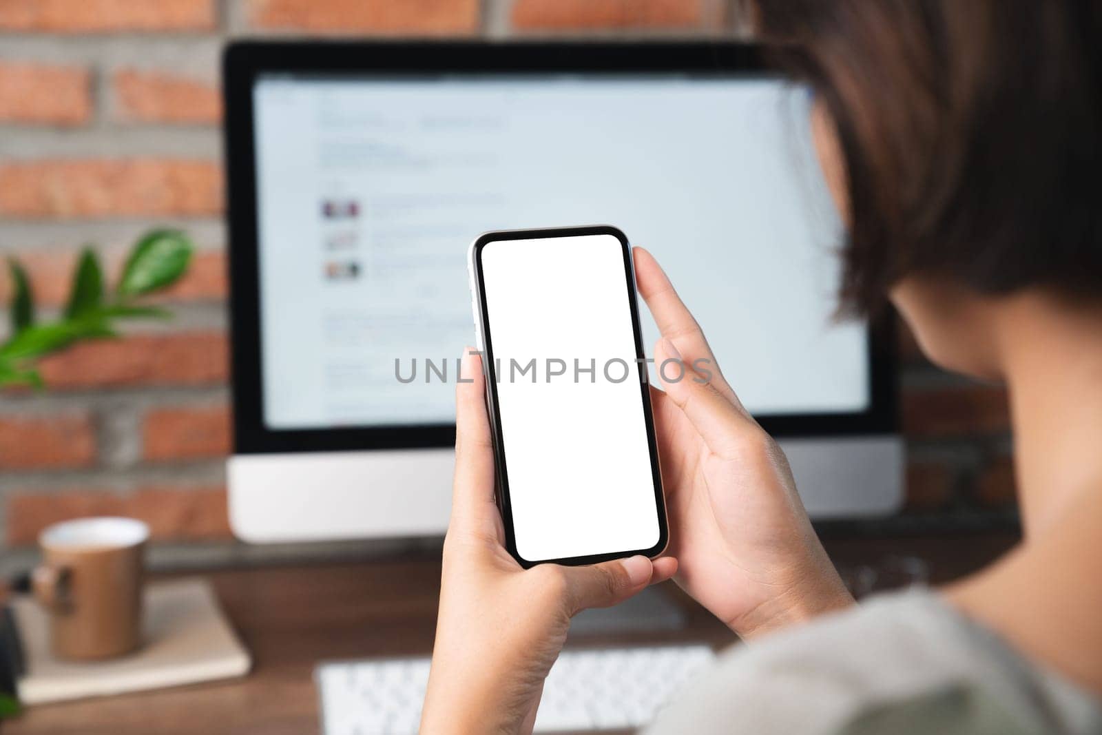female holding phone blank screen third person view clippig path inside